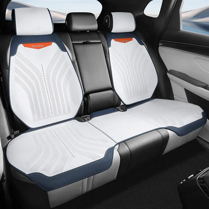 White perforated leather car seat covers with navy blue trim for BYD interior protection.