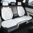 White perforated leather car seat covers with navy blue trim for BYD interior protection.