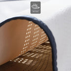 Breathable tan perforated leather car mat material with dark edge trim.