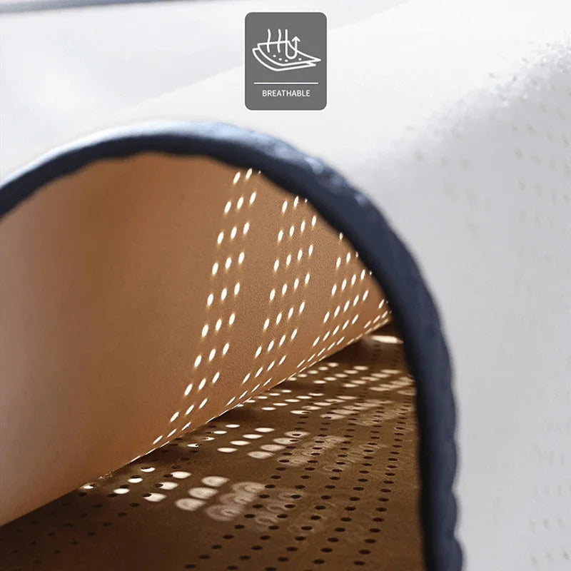 Breathable tan perforated leather car mat material with dark edge trim.