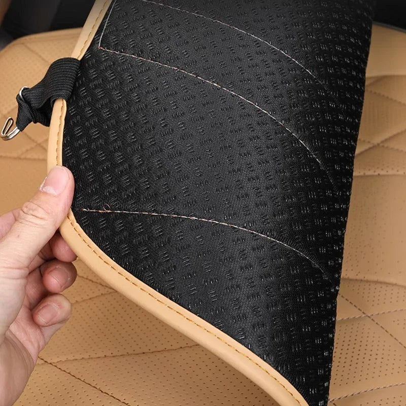 Black textured waterproof car floor mat with tan leather trim and durable stitching.