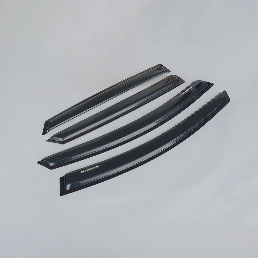 Set of four glossy black acrylic car window rain guards and wind deflectors.