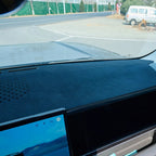 Professional black suede anti-glare dashboard cover for a car interior.