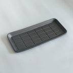 Sleek grey textured rectangular car tray organizer for organized storage.