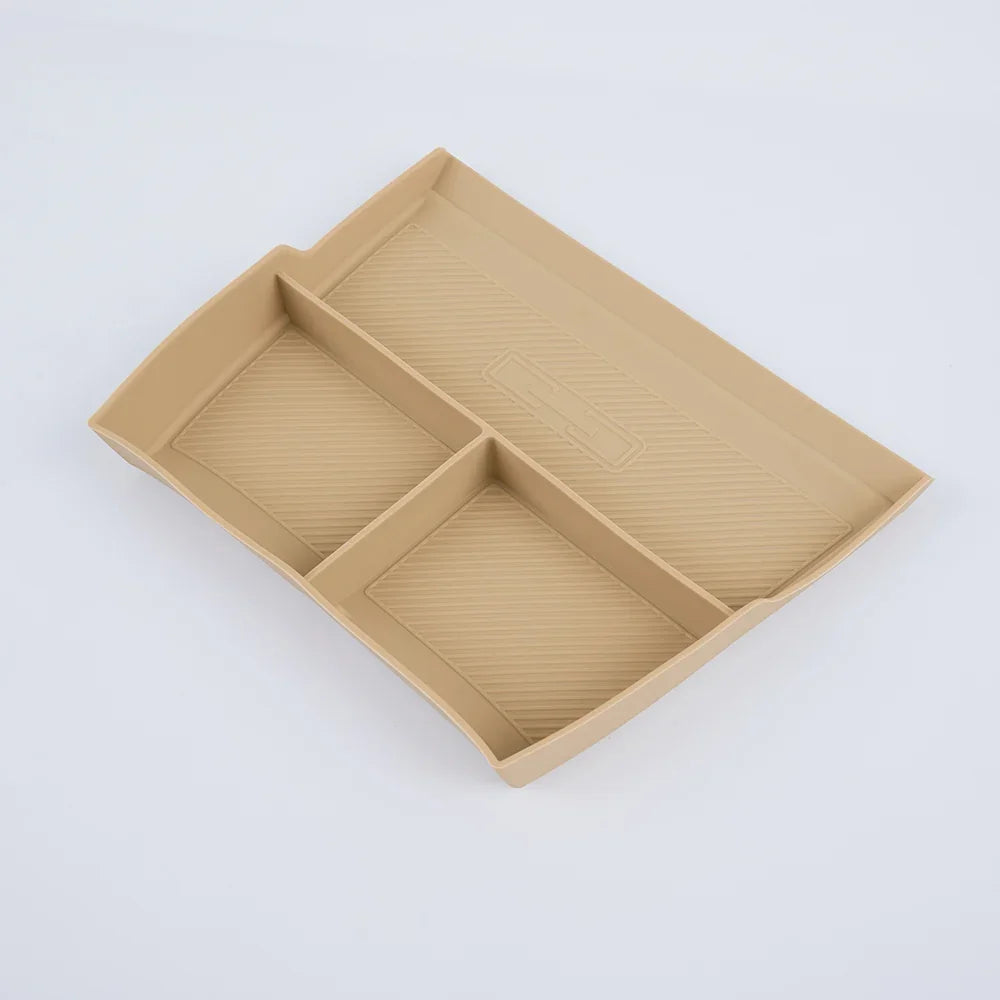 Beige TPE center console organizer tray with three compartments for BYD vehicle interior.