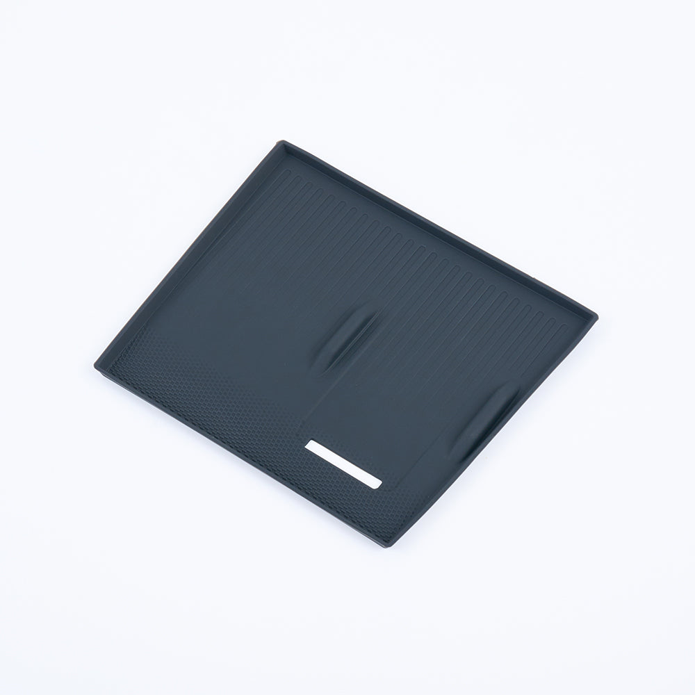Durable black TPE car trunk mat with anti-slip grooves and raised edges for BYD protection.