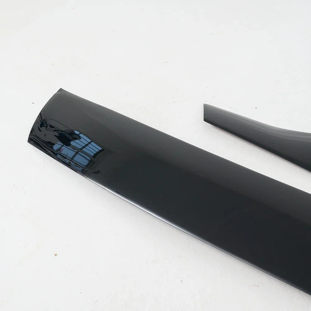 Glossy black aerodynamic side skirt trim made of durable high-gloss material.