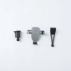 Grey matte plastic car air vent mount kit with adjustable ball joint and clip components.