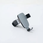 Sleek grey matte metallic car phone holder with adjustable silicone-grip arms.