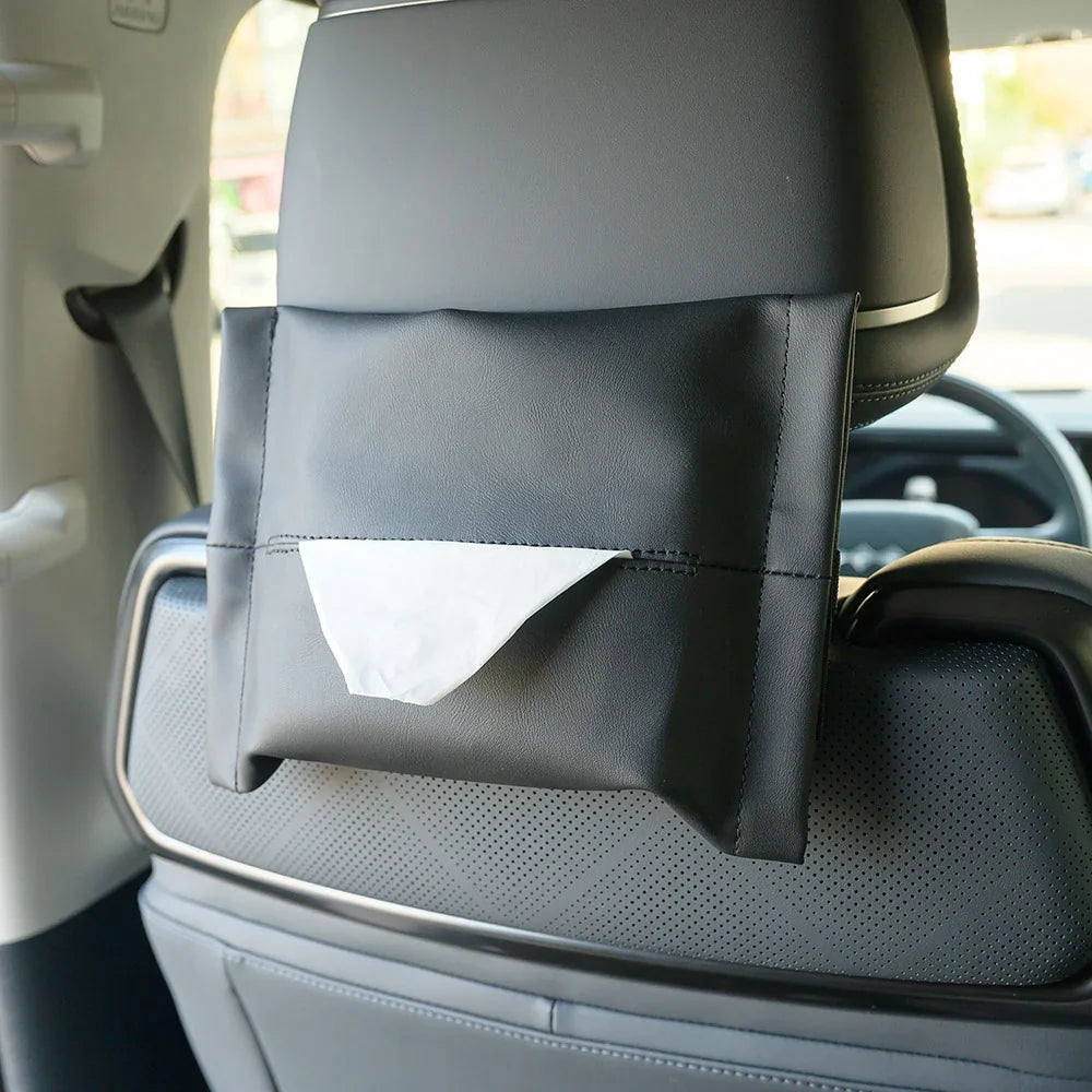Black leather car seat back organizer with a white tissue dispenser for BYD accessories.