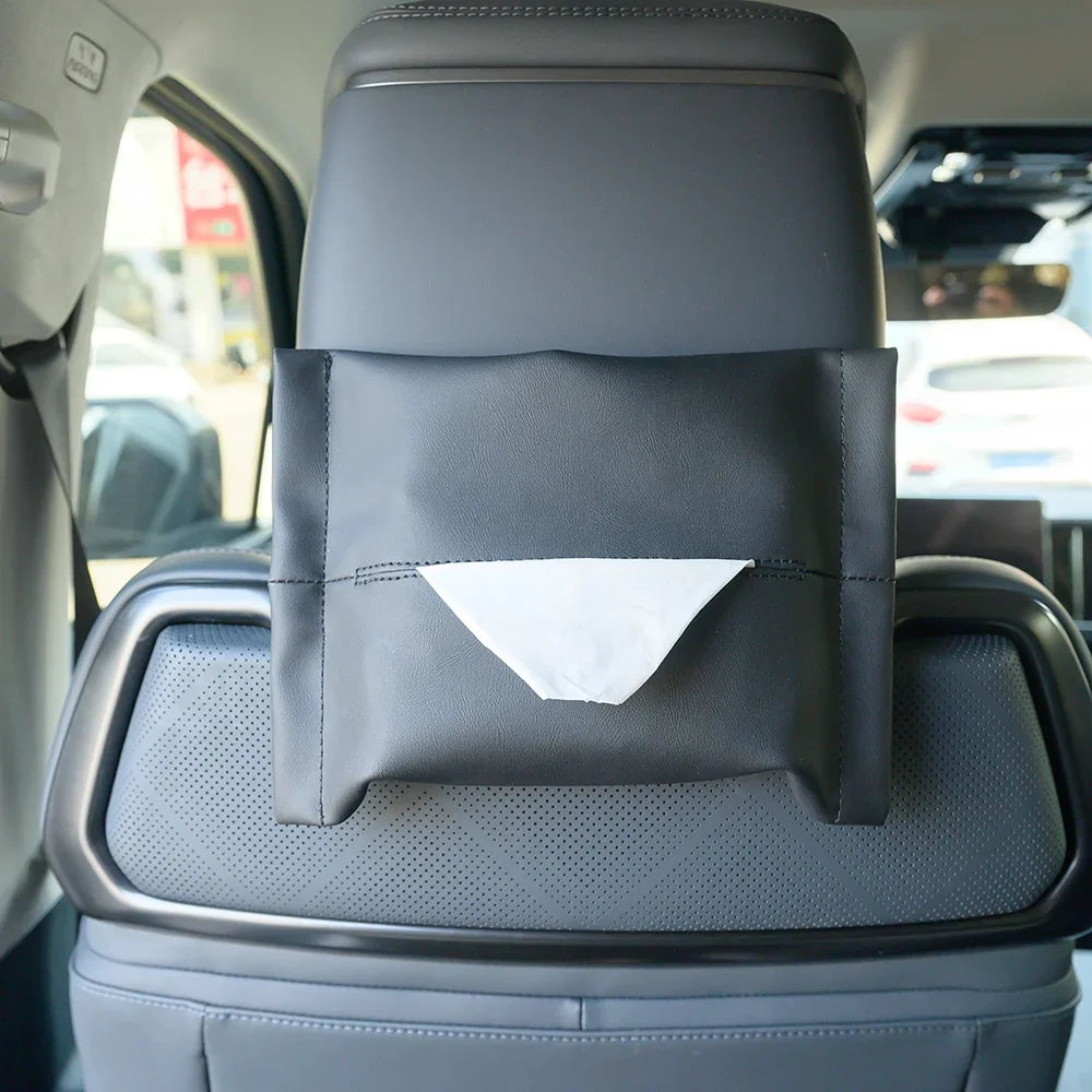 Black faux leather car seat back organizer with a white tissue dispenser for BYD interior.