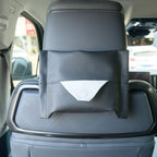 Black faux leather car seat back organizer with a white tissue dispenser for BYD interior.