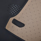 Premium black and beige two-tone faux leather car floor mat with perforated texture.