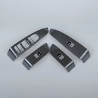 Set of four carbon fiber interior trim panels in grey for car center console upgrades.