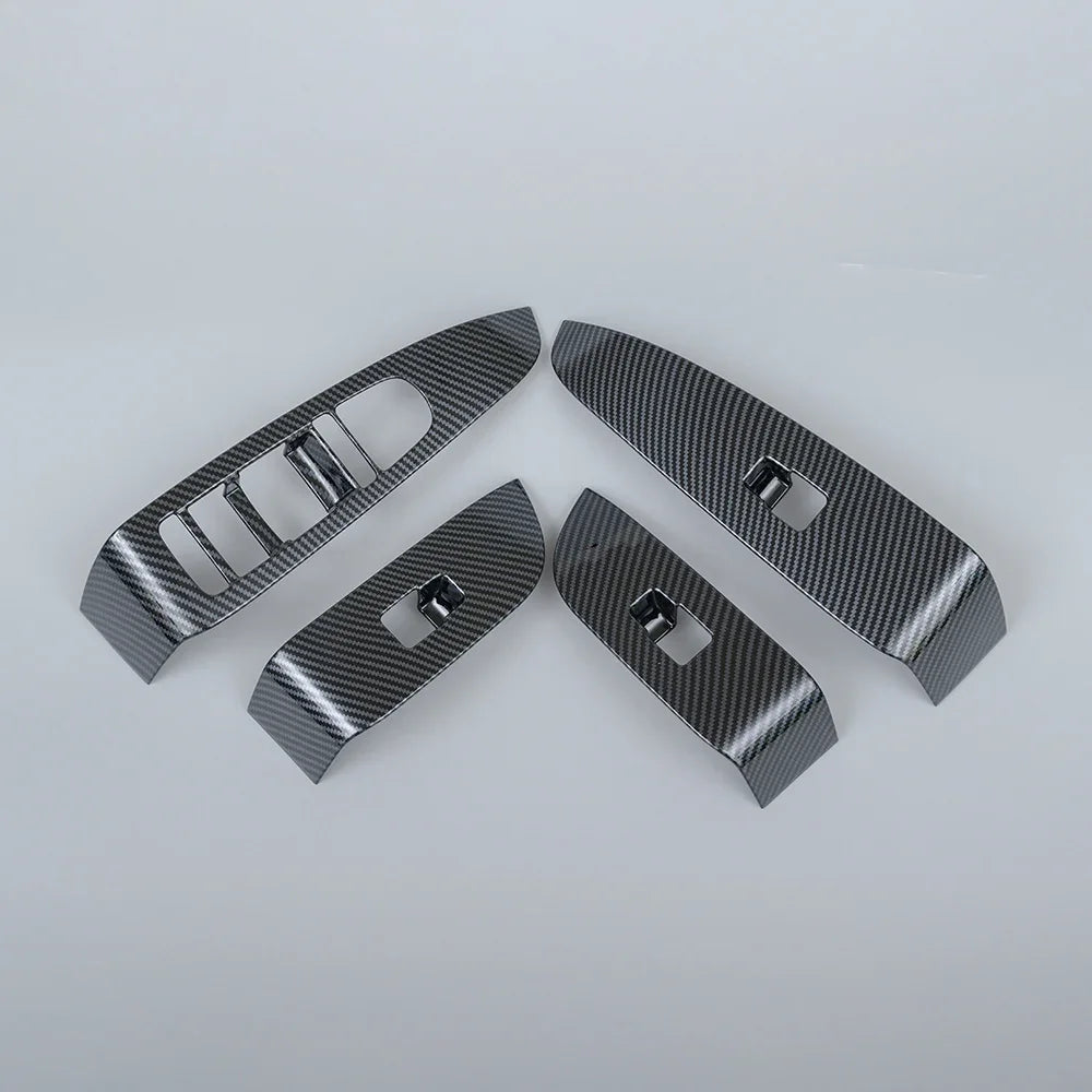 Set of four carbon fiber interior trim panels in grey for car center console upgrades.
