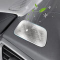 Silver perforated metal car air purifier emitting cool air with green leaves and snowflakes