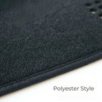 Black polyester style car floor mat with soft textured fabric surface.