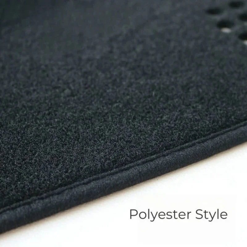 Black polyester style car floor mat with soft textured fabric surface.