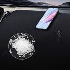 Black textured leather car mat featuring white absorbent granules for spill protection.