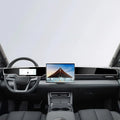 Modern black car interior featuring a sleek wide touchscreen display and premium leather dashboard.