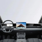 Modern black car interior featuring a sleek wide touchscreen display and premium leather dashboard.