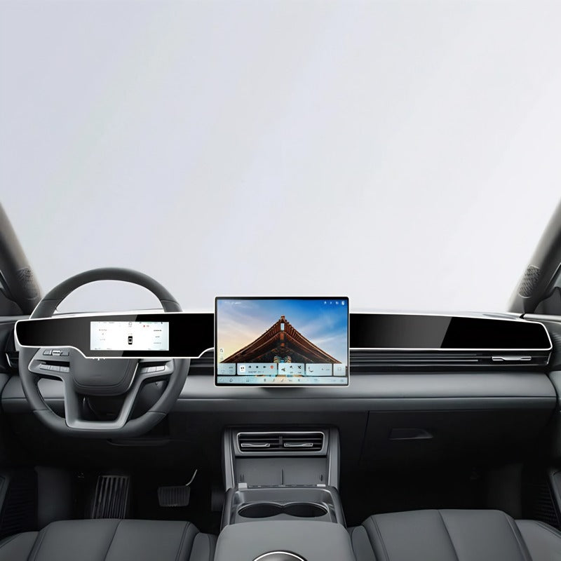 Modern black car interior featuring a sleek wide touchscreen display and premium leather dashboard.