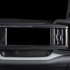 Black carbon fiber trim panel for BYD dashboard featuring a sleek textured finish.