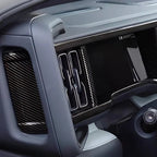 Black carbon fiber trim kit for BYD dashboard featuring a sleek, glossy texture.