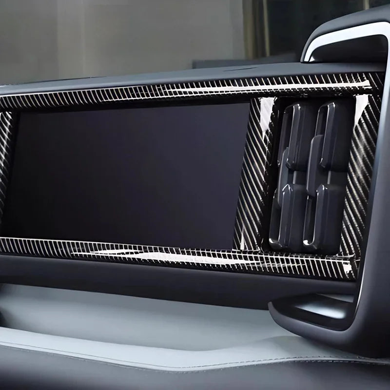 Black carbon fiber texture dashboard trim for BYD interior enhancement.