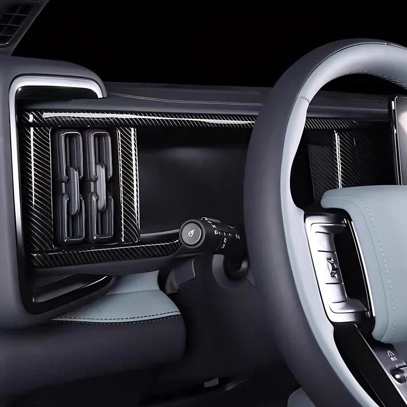 Black carbon fiber texture dashboard trim panel for BYD interior enhancement.
