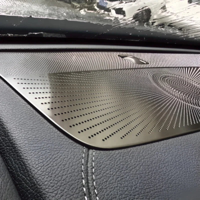 Premium brushed metal dashboard trim with a perforated pattern for a sleek, modern interior.