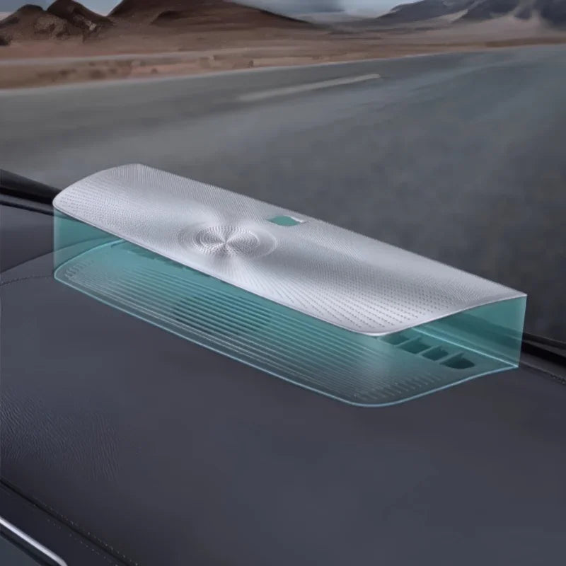 Sleek silver and translucent teal car organizer tray placed on a dark dashboard.