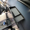 Black matte plastic car dashboard organizer tray with grey felt lining for BYD interior.