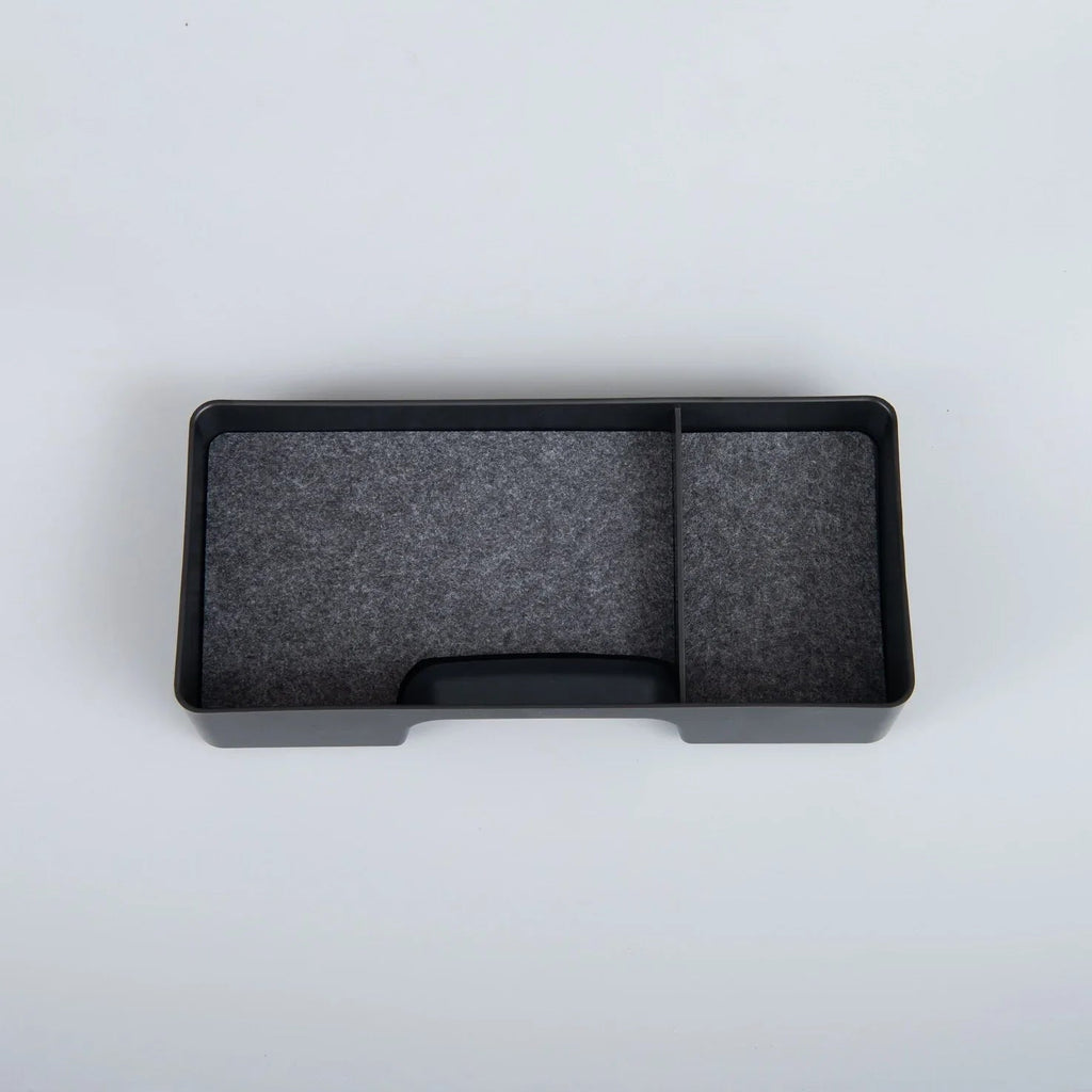 Black dual-compartment car center console organizer tray made of durable matte material.