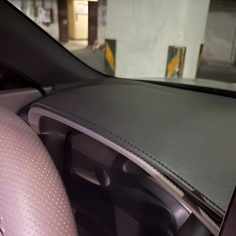 Black leather dashboard cover with precision stitching for BYD interior protection.