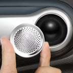 Silver stainless steel mesh strainer being placed into a car cup holder