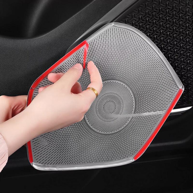 Transparent TPU protective film being applied to a car door pocket to prevent wear and tear.
