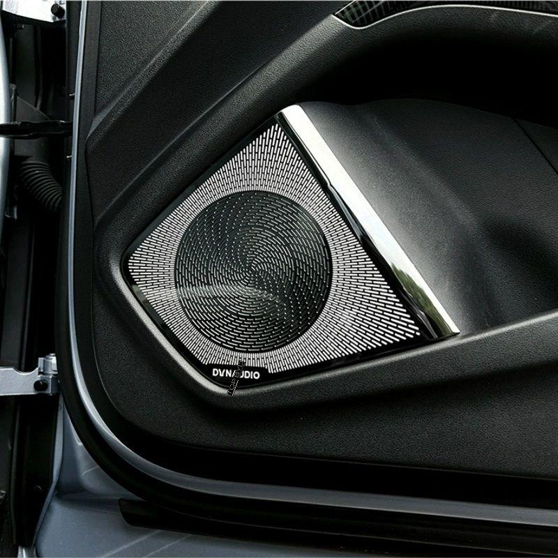 Premium black metal speaker grille with a sleek chrome trim installed on a car door panel.