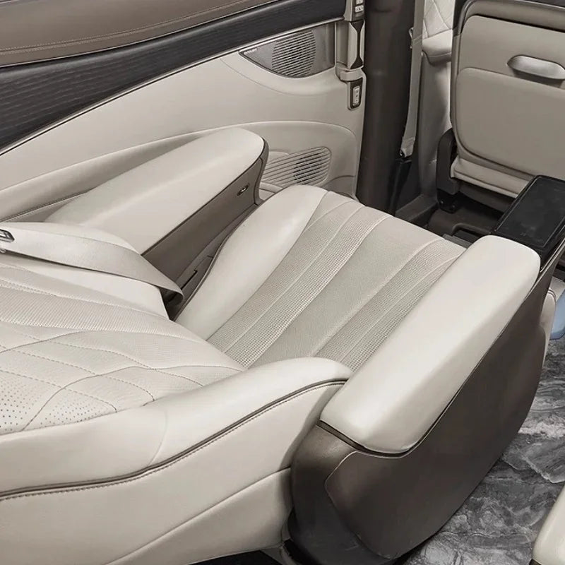Premium white leather car seat upholstery with diamond stitching pattern.