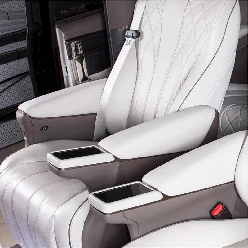 White and grey luxury leather car seat with integrated armrests and diamond-stitched upholstery.
