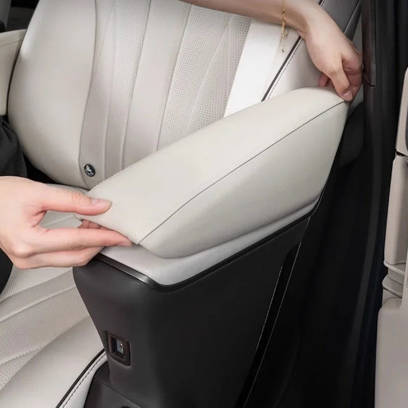 Premium cream-colored leather armrest cover for car interior protection.