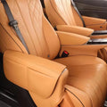 Premium tan leather car seat covers with diamond stitching and ergonomic armrests