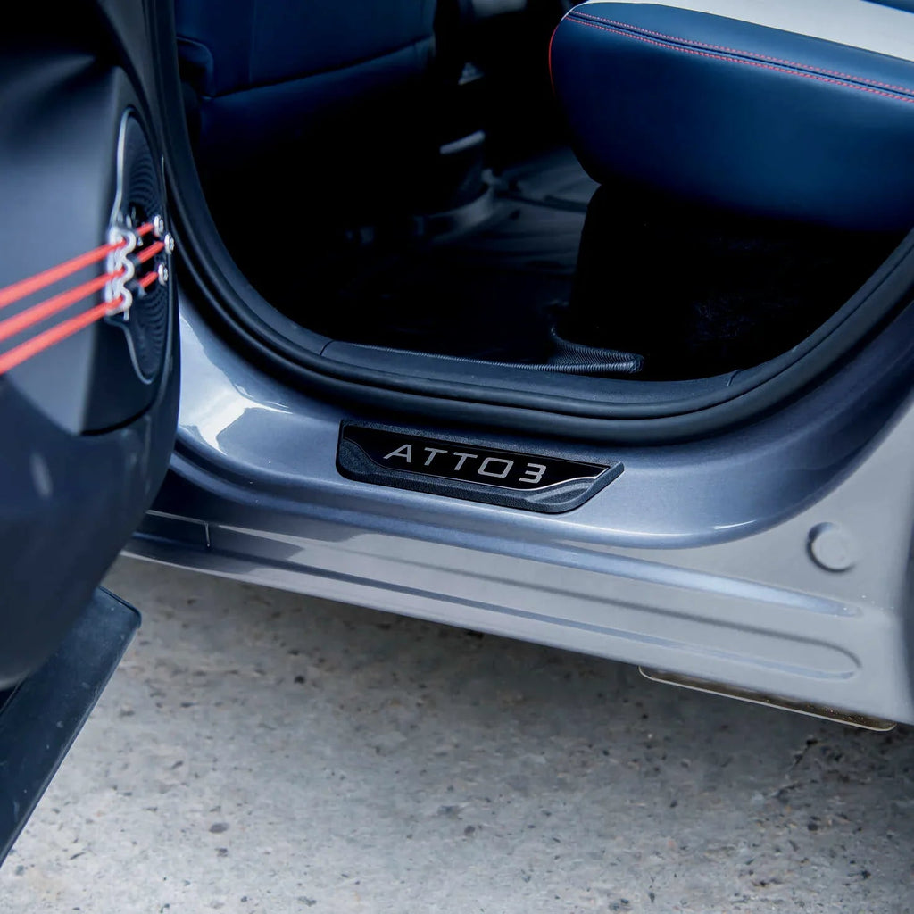 Black textured protective door sill plate with ATTO 3 engraving for BYD vehicles.