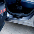 Black textured protective door sill plate with ATTO 3 engraving for BYD vehicles.