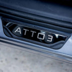 Sleek black glossy ATTO 3 door sill protector guard for car door protection.