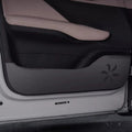 Black leatherette door kick protector with decorative star-shaped perforated pattern.