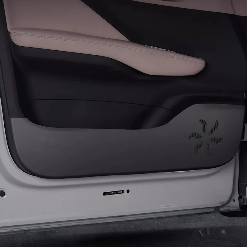 Black leatherette door kick protector with decorative star-shaped perforated pattern.