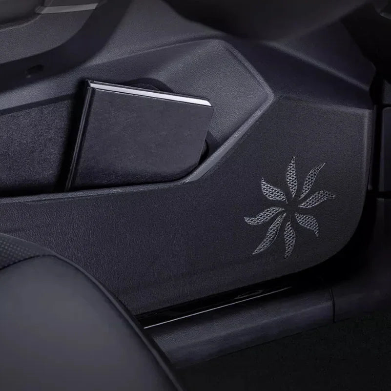 Black textured leather door pocket protector with elegant silver starburst pattern.