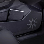 Black textured leather door pocket protector with elegant silver starburst pattern.