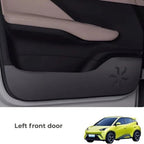 Black matte textured door kick protector for left front car door to prevent wear and scratches.